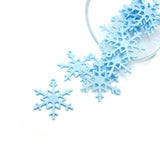 A blue snowflake charm, approximately 22×26 mm, featuring intricate cutout detailing—shown dangling against a clean white background.