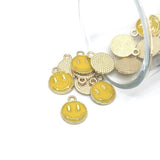 yellow enamel smiley face charm – 14x12mm – bright and cheerful jewelry accessory