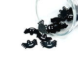 Small black Halloween spider charm with a smiling face and detailed legs, shown on a white background.