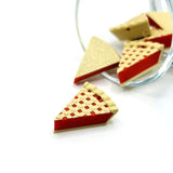 3D cherry pie charm with red filling and a golden lattice crust design, shown on a white background.