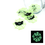 Glowing green spider webs with black spiders on a white background
