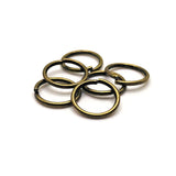 10mm bronze open jump rings in 18-gauge thickness, shown in bulk quantity.