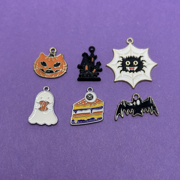 A set of 12 enamel-filled Halloween charms (6 different designs, two of each) displayed together.