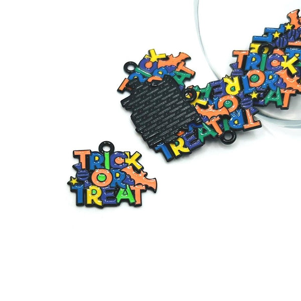 Colorful 'Trick or Treat' Halloween-themed charms on a white background