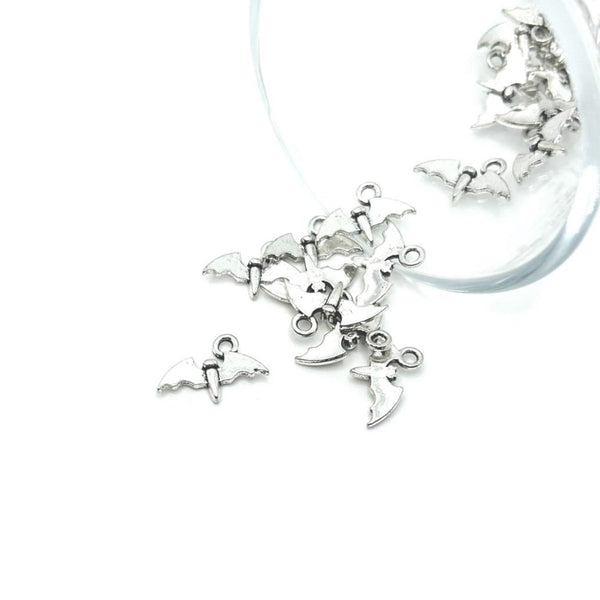 Tiny silver bat charm with outstretched wings, approximately 9.5×14 mm, shown on a white background.