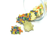 Gold-tone charm with “TRICK OR TREAT” text, displayed against a white background.