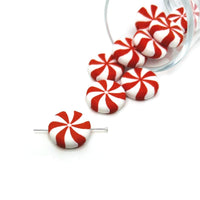 Round beads featuring red and white peppermint-style swirls, approximately 20×20 mm, displayed on a neutral background.
