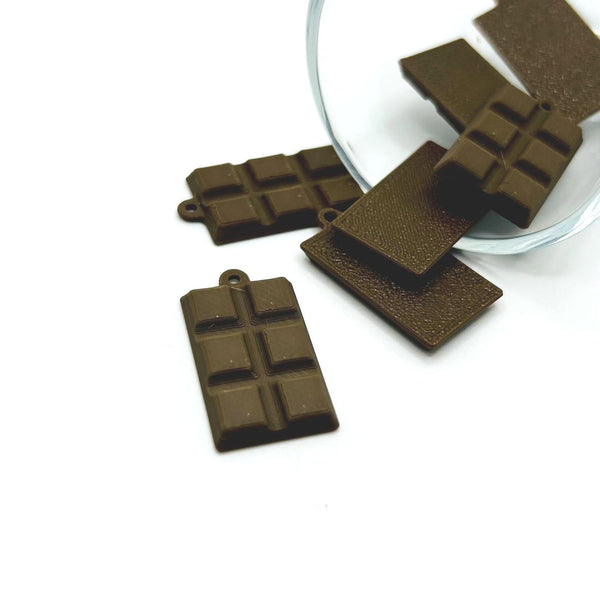 Miniature 3D chocolate candy bar charm with detail ridges and a rich brown finish, shown on a white background.