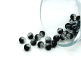 Round 6 mm black and clear crackle glass beads in a mixed pack, showing the distinctive internal crackle texture and glossy finish, displayed on a white background.