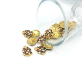 Gold and red gift box charms on a white background