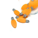 orange christmas light charms on a white background