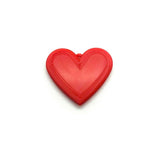 red heart charm on a white background