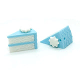 Two blue and white cake-shaped erasers on a white background