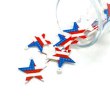 Red, white, and blue star-shaped charms on a white background