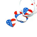 Heart-shaped charms with American flag design on a white background
