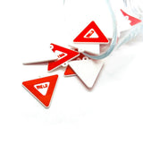 Red and white yield street signs on a white background