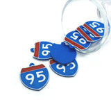 Blue and red interstate road sign-shaped charms with '95' printed on them, displayed on a white background.