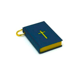 Blue bible charm with a gold cross on a white background