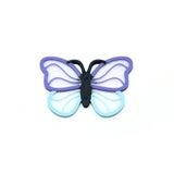 Butterfly-shaped charm with purple and blue wings on a white background