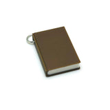 Brown  book-shaped charm on a white background