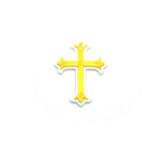 White and gold cross with decorative elements on a white background