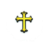 Gold and black ornate cross on a white background