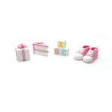 Set of baby-themed charms including shoes, blocks, and a cake on a white background