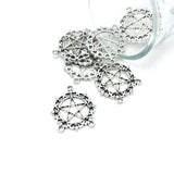 Silver pentacle pendants on a white background