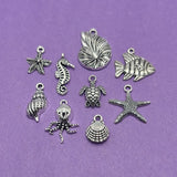 54-piece antique silver ocean and marine charm assortment with 9 beach-themed jewelry charms for DIY jewelry making and crafts.