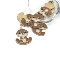 Cute brown and white otter charms in bulk