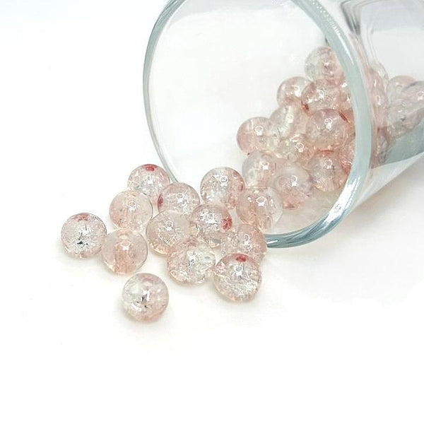 8.5 mm pink and clear crackle glass beads on a string, sparkling with textured facets—ideal for jewelry-making and craft projects.