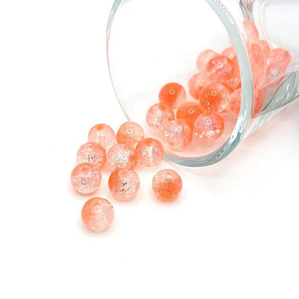 8.5 mm orange and clear crackle glass beads on a string, showcasing textured facets and sparkling warm hues—ideal for jewelry-making and craft projects.