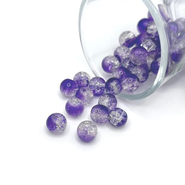 8.5mm purple and clear crackle glass beads on a string, sparkling with textured facets—perfect for jewelry-making and craft creations.