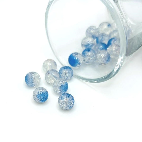 8.5 mm blue and clear crackle glass beads on a string, sparkling with textured facets—ideal for jewelry-making and craft projects.