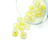 8.5 mm yellow and clear crackle glass beads on a string, sparkling with textured facets—perfect for jewelry-making and craft projects.