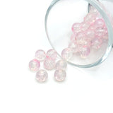 8.5 mm pink and clear crackle glass beads on a string, sparkling with textured facets—perfect for jewelry-making and craft creations.
