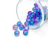 8 mm crackle glass beads in blue and purple hues on a string, sparkling with textured facets—great for jewelry-making and craft creations.