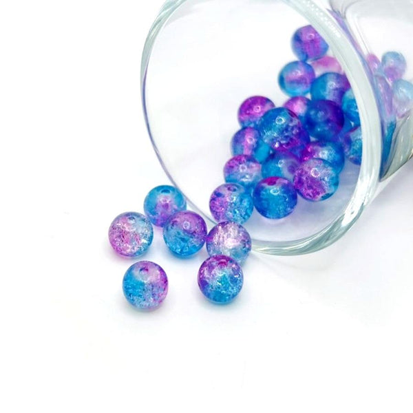 8 mm crackle glass beads in blue and purple hues on a string, sparkling with textured facets—great for jewelry-making and craft creations.