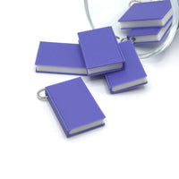3D purple book charm measuring 27 × 18 mm with detailed cover design—ideal for jewelry, keychains, and craft projects.