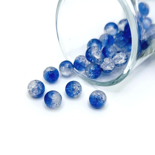 8mm round blue and white crackle glass beads grouped on a white background, showing their frosted and glossy texture.