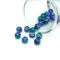 8mm round crackle glass beads in purple and green hues, shown in a clustered pile on a white background.