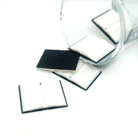 3D black open book charm with visible pages and gold accents, displayed on a white background.