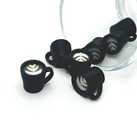 3D latte coffee cup charm with a white mug and tan latte swirl on top, displayed on a white background.
