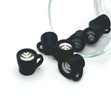 3D latte coffee cup charm with a white mug and tan latte swirl on top, displayed on a white background.