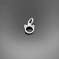 A tiny sterling silver cat charm, approximately 8 × 7 mm, with stylized cat silhouette and top loop, displayed on a clean black background.
