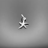 A polished sterling silver starfish charm, approximately 15×10 mm (including loop), with realistic texture and detailing, shown against a black background.