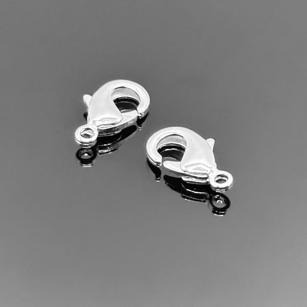 A polished sterling silver lobster clasp (7×12 mm) with integrated ring, displayed on a clean white background.