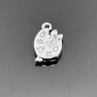 A 14 × 8 mm platinum-colored paint palette charm with smooth metallic finish, displayed against a white background—perfect for art-themed jewelry.