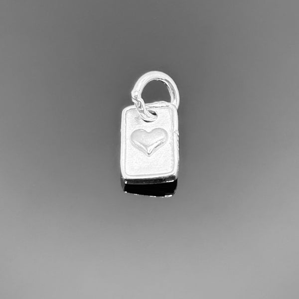 A sleek 10×6 mm sterling silver rectangle-shaped heart charm with a small attachment hole, shown on a clean white background