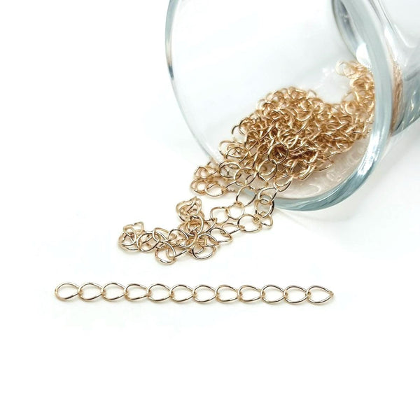 A 5 cm rose-gold-toned chain extender featuring delicate oval links with a clasp and loop attachment, displayed on a clean white background.